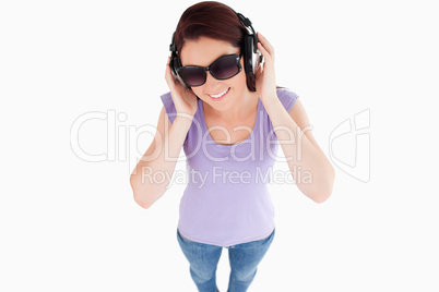 Cute Woman with headphones and sunglasses