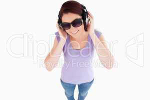 Cute Woman with headphones and sunglasses