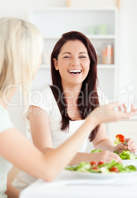 Portrait of cheerful Women eating salad