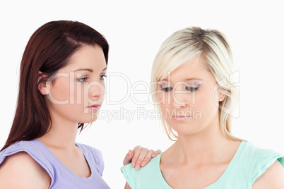 Gorgeous women comforting her friend