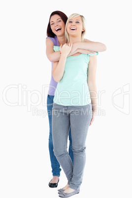 Laughing Women hugging