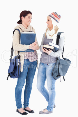 Students with books talking