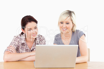 Gorgeous women learning with notebook and books