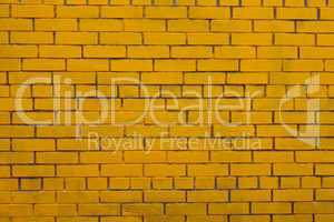 old yellow painted brick wall