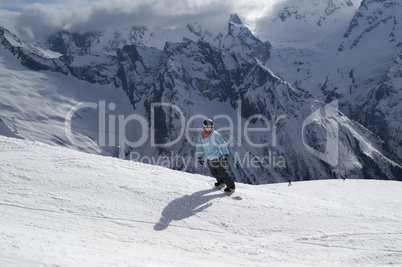 Snowboarder on ski slope