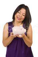 Smiling Hispanic Woman Holding Piggy Bank on White