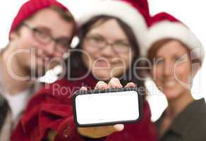Girl with Friends and Santa Hats Holding Blank Smart Phone