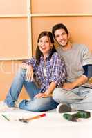 Home improvement young couple relax on floor