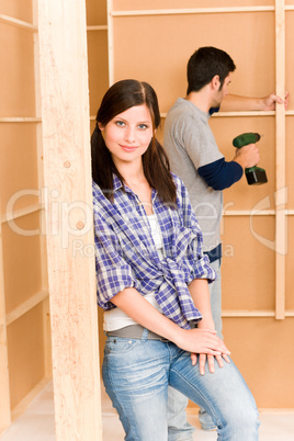 Home improvement young couple fixing wall