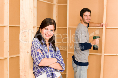 Home improvement young couple fixing wall