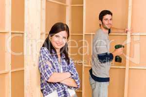 Home improvement young couple fixing wall