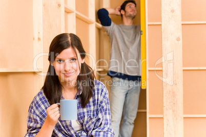 Home improvement young couple fixing wall