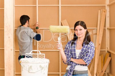 Home improvement: young couple fixing new house