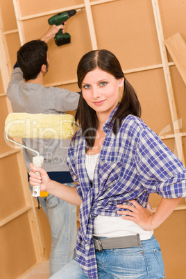 Home improvement: young couple fixing new house