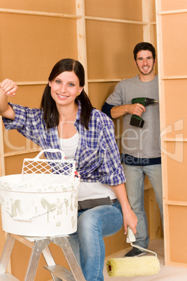 Home improvement: young couple fixing new house