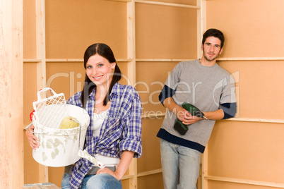 Home improvement: young couple fixing new house