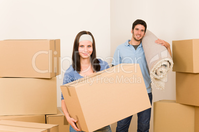 Home moving young couple boxes and carpet