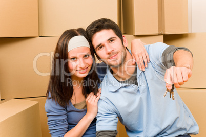Moving new home young couple hold keys