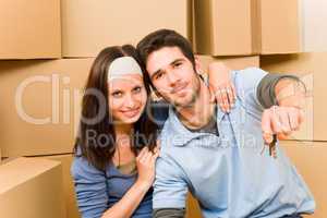 Moving new home young couple hold keys