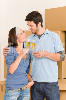 Moving into new home young couple toast