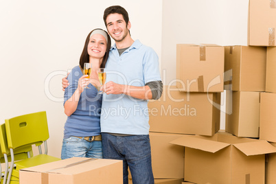 Moving into new home young couple toast