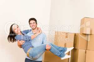 Moving new home young man holding woman