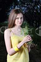 Cute Girl Holding Bunch Of Grass