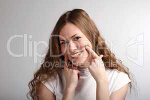 Girl Stretching Her Smile With Fingers
