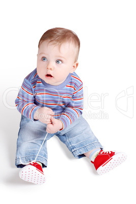Small Child Playing With His Shoe-laces