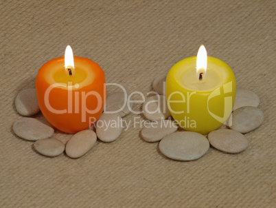 Two multicolored glowing candles.