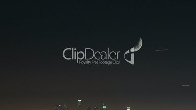 Downtown Los Angeles at night with moon