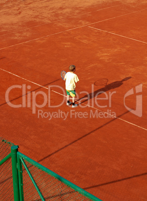 Boy On Tennis Court