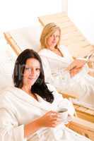 Beauty spa relax two women on sun-beds