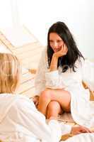 Beauty spa room two women relax chatting