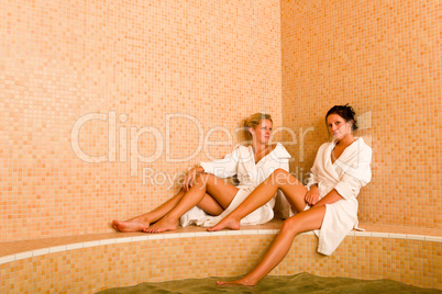 Relax spa pool two women sitting bathrobe