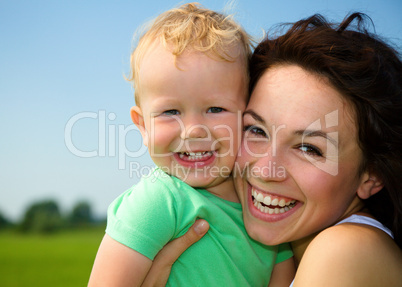 Child with mother play outdoors