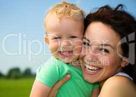 Child with mother play outdoors