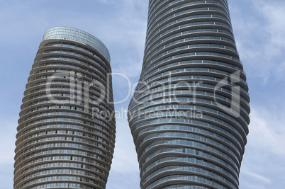 Close-up of round high rises.