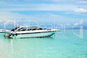 Motor boat on turquoise water of Indian Ocean, Phi Phi island, T