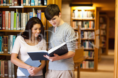 Young students reading a book