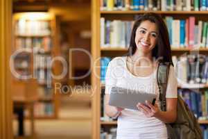 Smiling student using a tablet computer