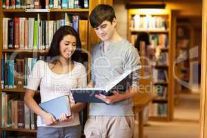 Beautiful students reading a book