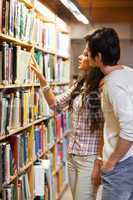 Portrait of students choosing a book