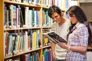 Young adults reading a book