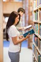 Portrait of students reading while standing up