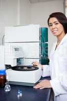 Portrait of a scientist using a centrifuge