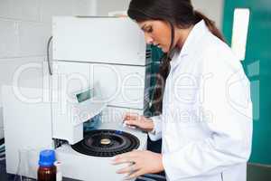 Scientist using a centrifuge