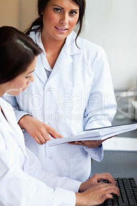 Portrait of scientists looking at a report