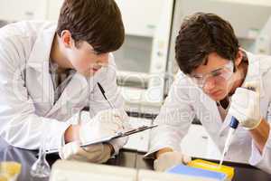 Male scientists making an experiment