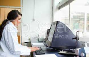 Female scientist using a monitor